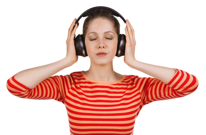 Girl, eyes closed, listening to music on headphones