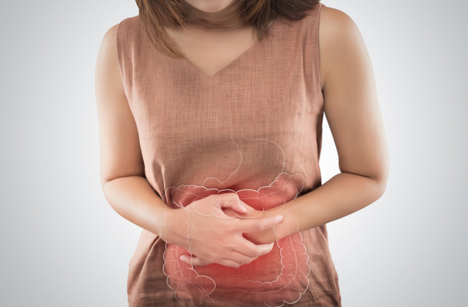 upset stomach IBD and IBS symptoms - Shutterstock