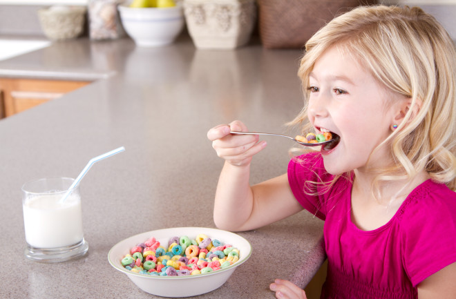 Girl Child Eating Sugar Cereal Fruit Loops Breakfast - Shutterstock