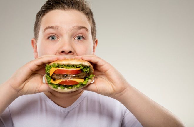 Eating Hamburger - Shutterstock