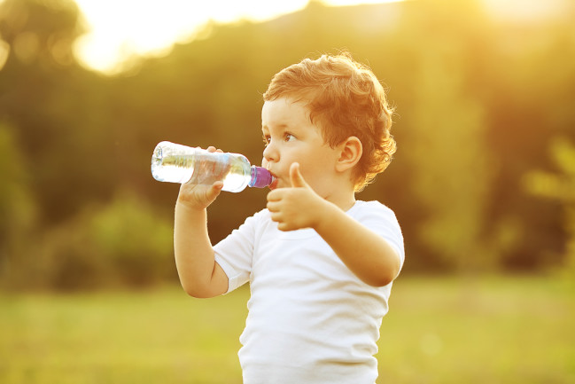 Kid Drinking Plastic Water Bottle - Shutterstock