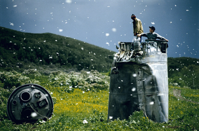 Villagers collecting scrap from a crashed spacecraft, surrounded by thousands of white butterflies. Environmentalists fear for the region's future due to the toxic rocket fuel. (Credit: Jonas Bendiksen/Magnum)
