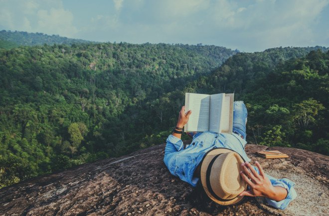 book reader mountains - shutterstock