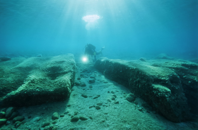 Underwater archaeologist studying sunken ruins off the coast of Calabria in Italy.