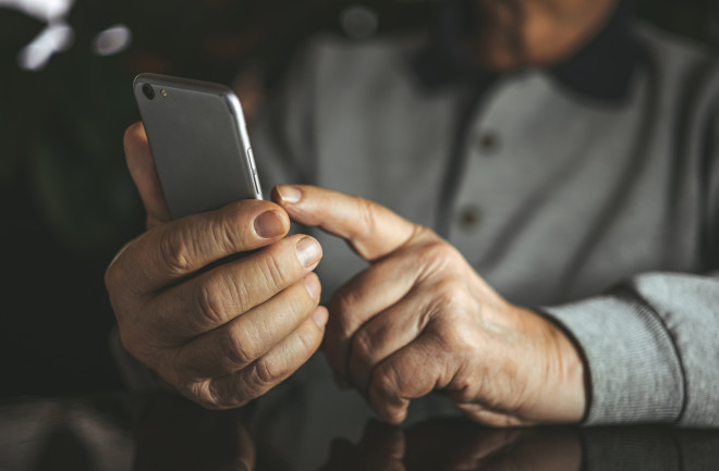 Older adult using a phone