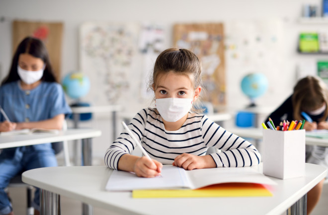 Back to School, Child in Face Mask in Classroom, COVID-19 - Shutterstock