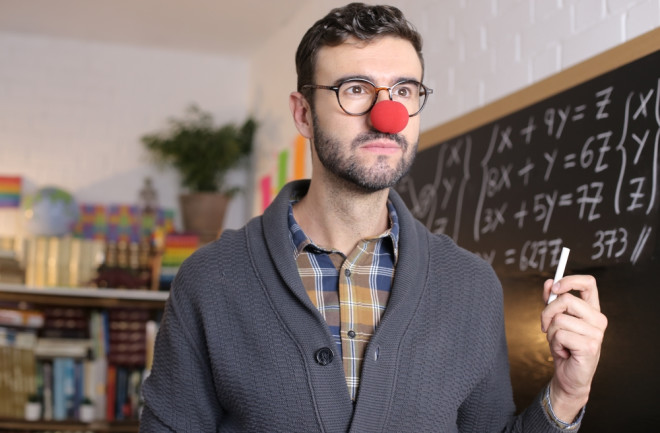 math-teacher-with-clown-nose-holding-chalk