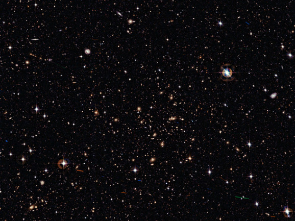 Why is space so dark even though the universe is filled with stars?