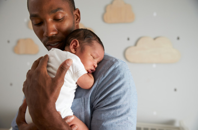 Dad Father Holding Baby - Shutterstock 