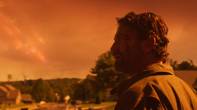 Interstellar Comet Clark looms behind a world tinged orange by fire in the new disaster movie "Greenland." (Credit: STXfilms)