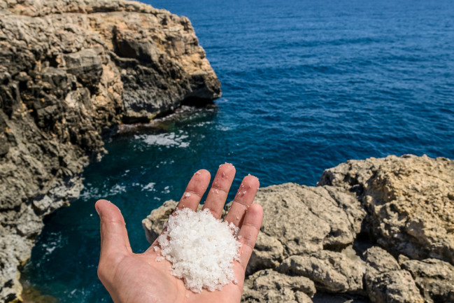 In the Plemmirio natural reserve in Sicily, Italy, I found some salt on the rocks left by the sea water after the tide. The arid landscape and the power of nature in this place are impressive.