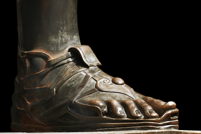 Foot of a statue with sandals