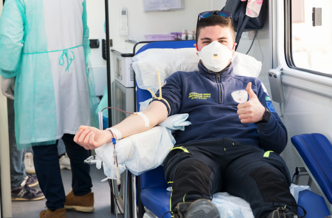 man donating blood coronavirus plasma - shutterstock