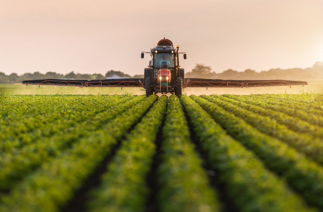 Tractor Spraying Crops - Shutterstock