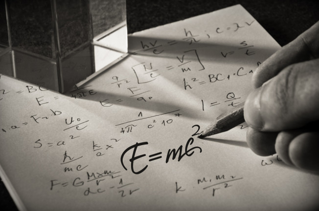 einstein's equation written on a piece of paper - shutterstock 476432692