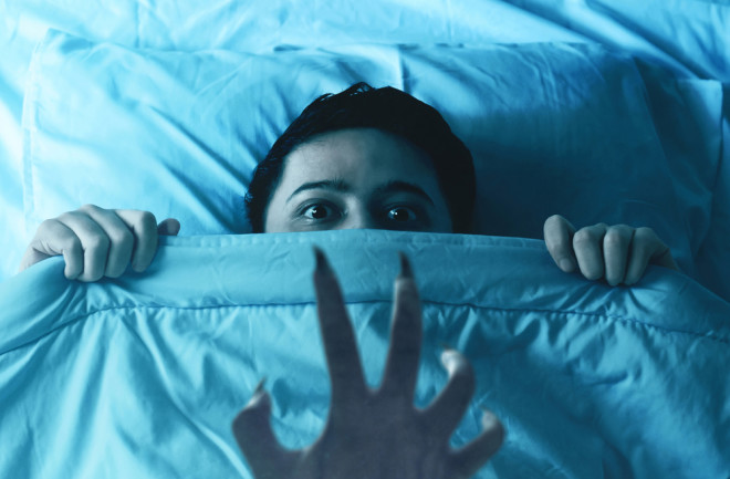 demon at night sleep paralysis concept - shutterstock