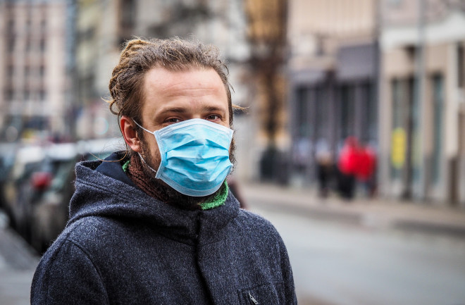 Man in Face Mask Pandemic - Shutterstock