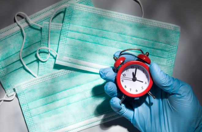 Coronavirus time clock concept - shutterstock