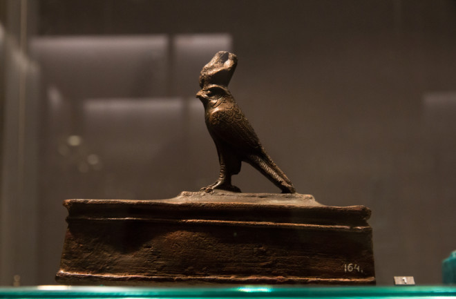 Leiden, The Netherlands - JAN 26, 2019: small bird coffin with a statue of Horus as a falcon from ancient Egypt. Sarcophagus.