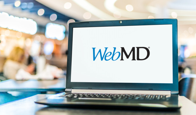 A laptop displaying the WebMD logo on its screen