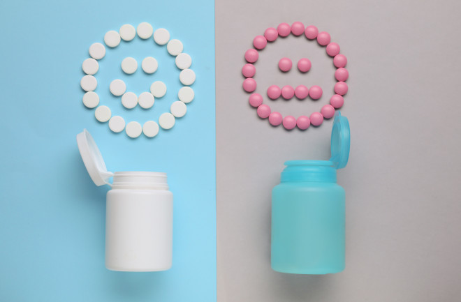white and pin pill wit two bottles shaped like faces