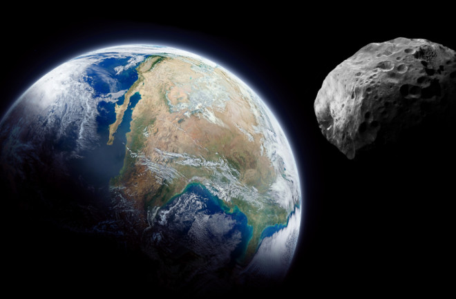 asteroid is approaching earth in outer space illustration - shutterstock 1389010817