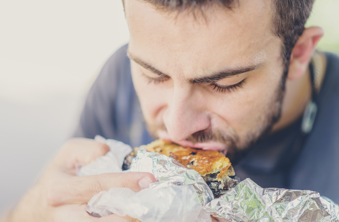 Man Eating - Shutterstock