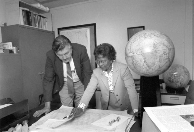Gladys West and Sam Smith look over data from the Global Positioning System, GPS