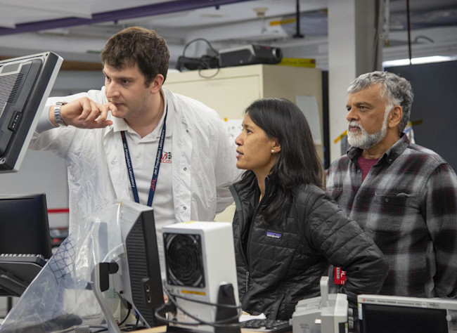 MiMi Aung (center) with NASA engineers Teddy Tzanetos (left) and Bob Balaram, who developed the concept of a Mars helicopter in the 1990s. (Credit: NASA/JPL-Caltech)