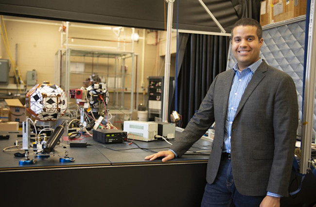 Richard Linares with a few of his Earth-based projects. (Credit: MIT)