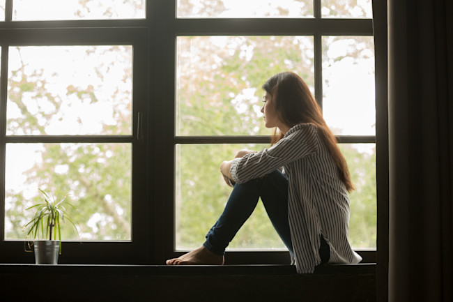 quarantine sad window - shutterstock