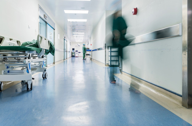 hospital blurred person in hallway Shutterstock