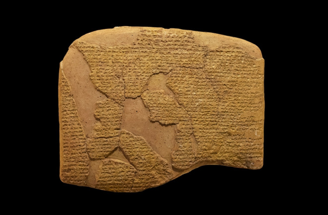 Cuneiform tablet of the Hittite Treaty of Kadesh isolated on a black background. 1300–1200 B.C.E.