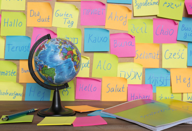 different languages on post it notes different colors globe
