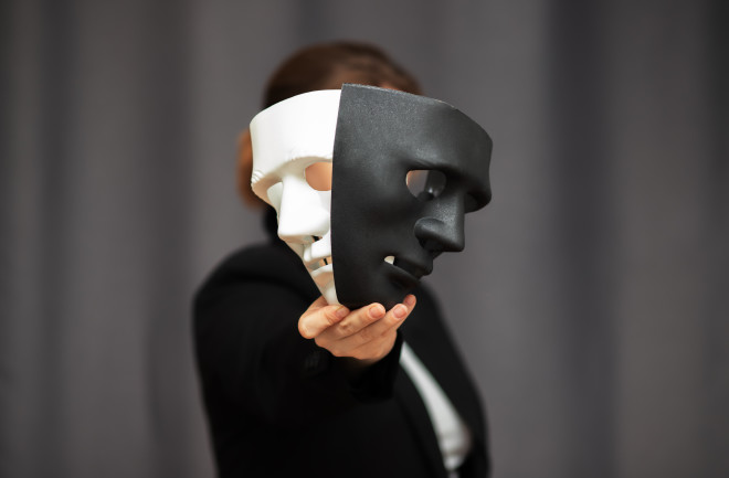 Theatre actor holding drama and comedy mask 