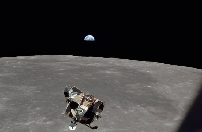apollo orbiting moon earth in background - shutterstock 245965291