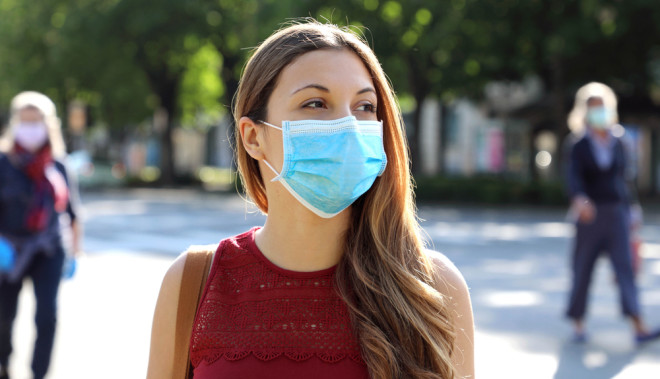 Coronavirus woman mask outdoors - shutterstock