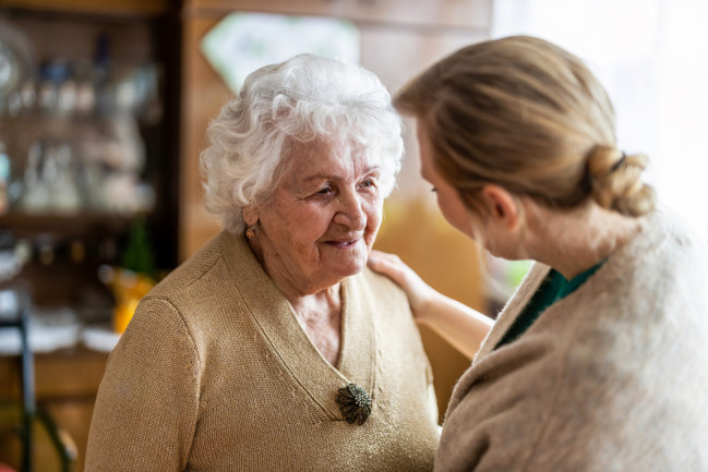 Health care worker talking to someone with dementia