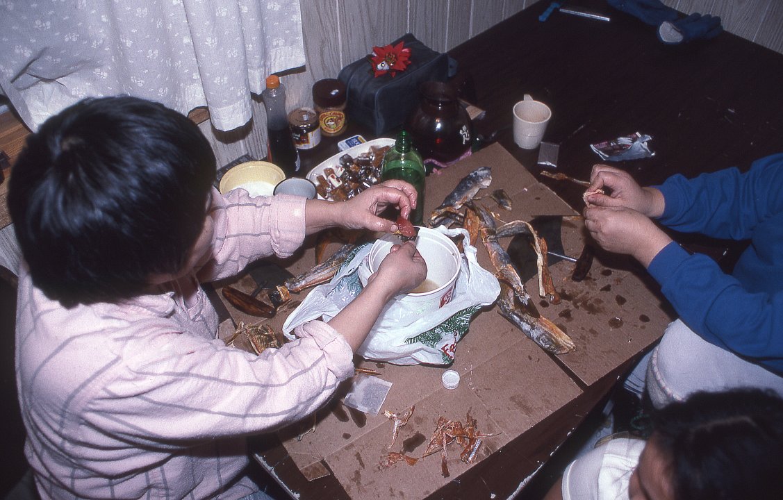 Inuit dipping dried fish