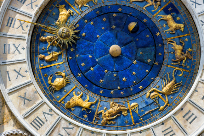 Ancient clock face italy roman numerals and zodiac - shutterstock