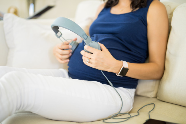 Pregnant mother listening to music