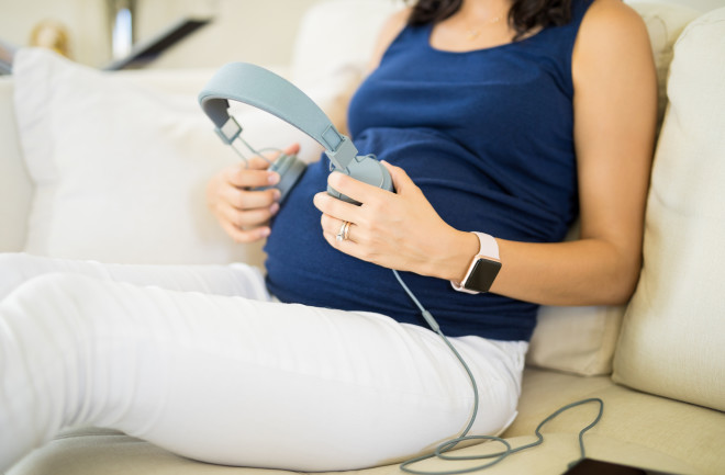 Pregnant mother listening to music