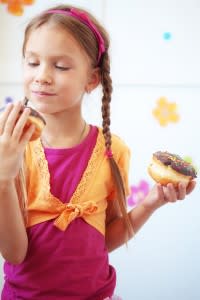 girl-eating-donuts-200x300.jpg