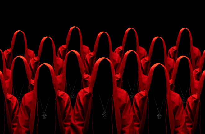 Group of mysterious people in red hooded cloaks representing a cult