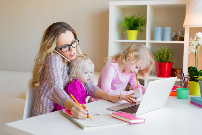 mom working from home and balancing childcare - shutterstock 1070125520