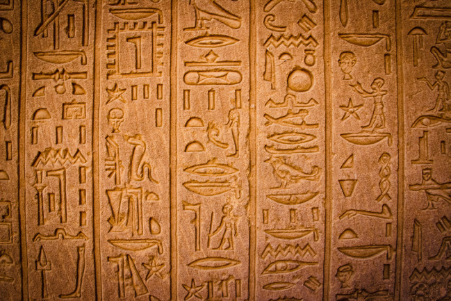 Egyptian hieroglyphics - shutterstock 1686830842