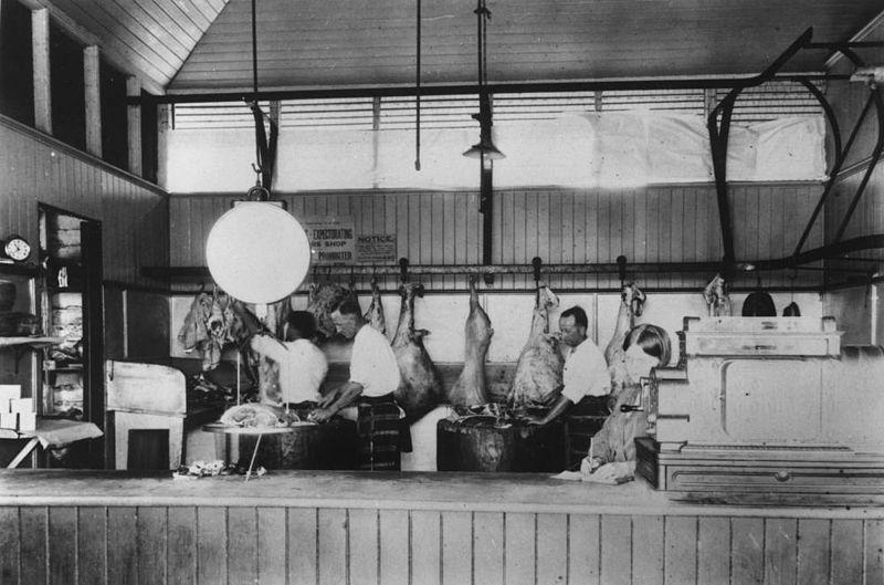 800px-StateLibQld 1 14914 Butchers at work inside Loch Bros Emerald ca 1928