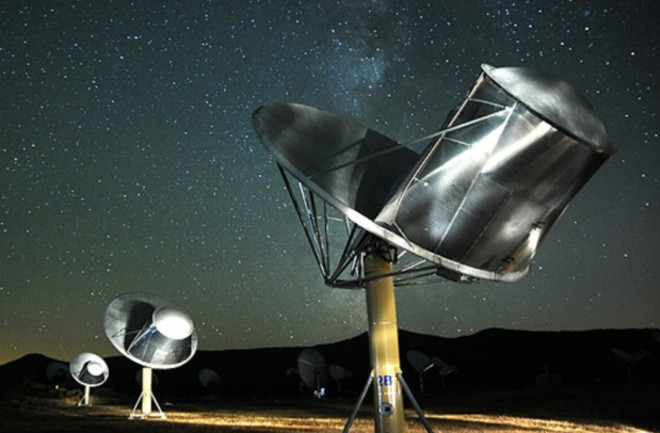 a telescope array at night - SETI