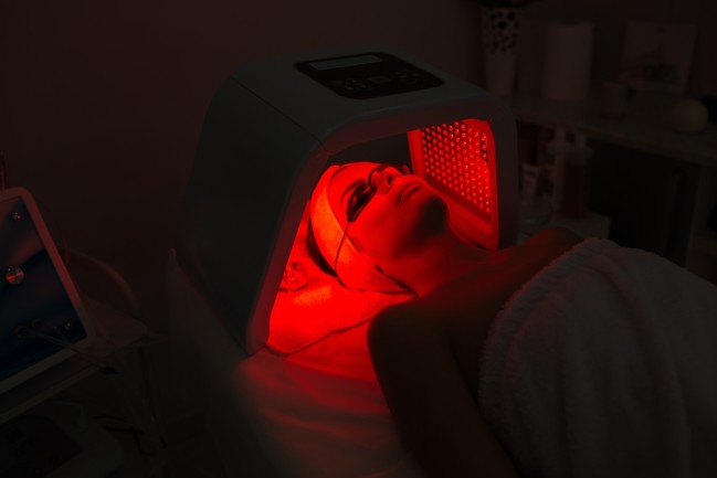 woman getting red light treatment