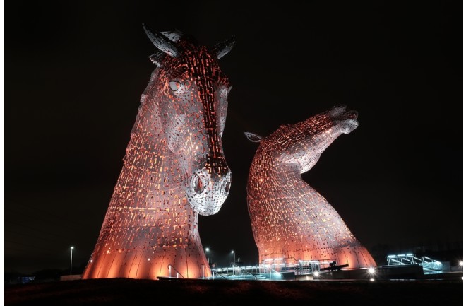 Falkirk Scotland - January 05 2015 The Kelpies are 30-metre-high (98 ft) horse-head sculptures depicting kelpies (shape-shifting water spirits) that are lit up at night in various colours